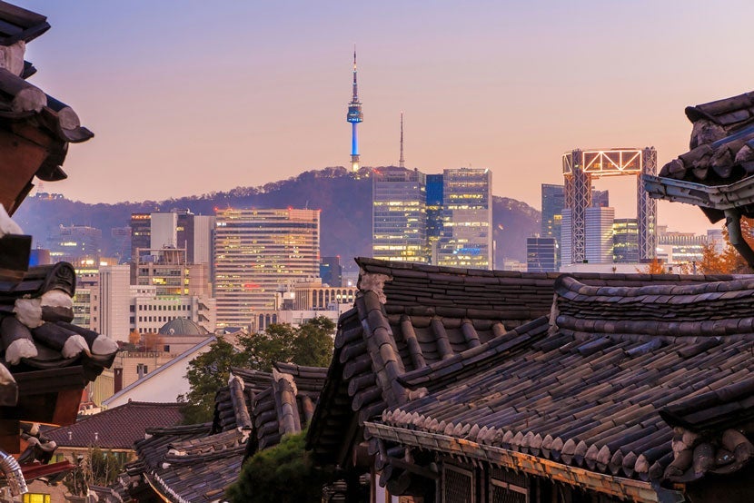 A view of Seoul from the Bukchon Hanok Village rooftops. Image courtesy of <a href="http://www.shutterstock.com/dl2_lim.mhtml?src=0eR30vU25iCbV5aUXCj7Bg-1-9&amp;clicksrc=download_btn_inline&amp;id=265034222&amp;size=medium_jpg&amp;submit_jpg=" target="_blank">Shutterstock</a>.