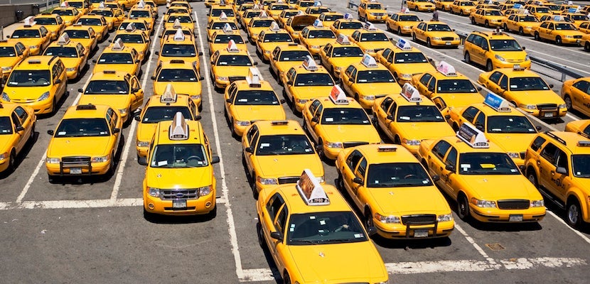 Rows of taxis waiting at airport