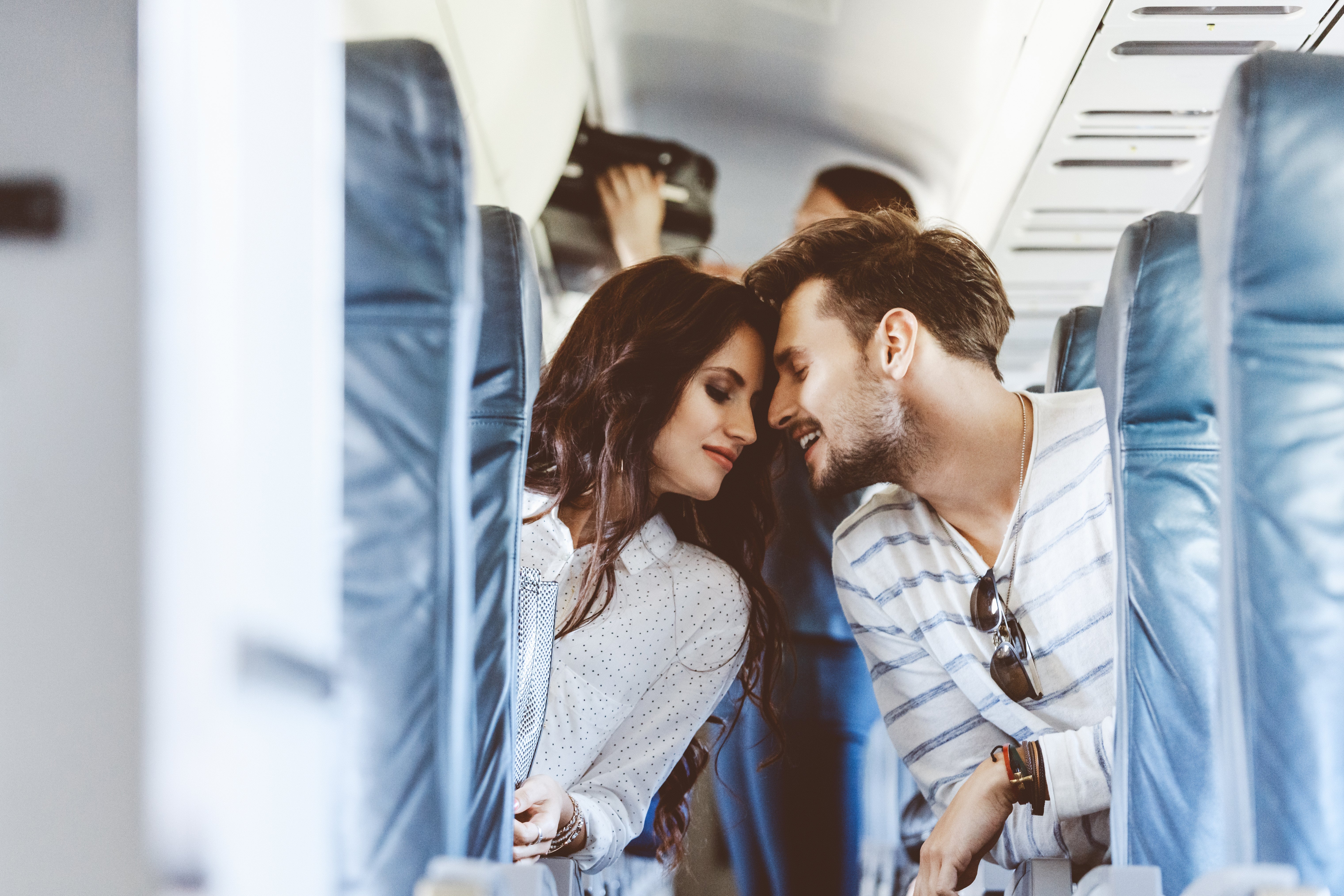 Loving young couple during flight
