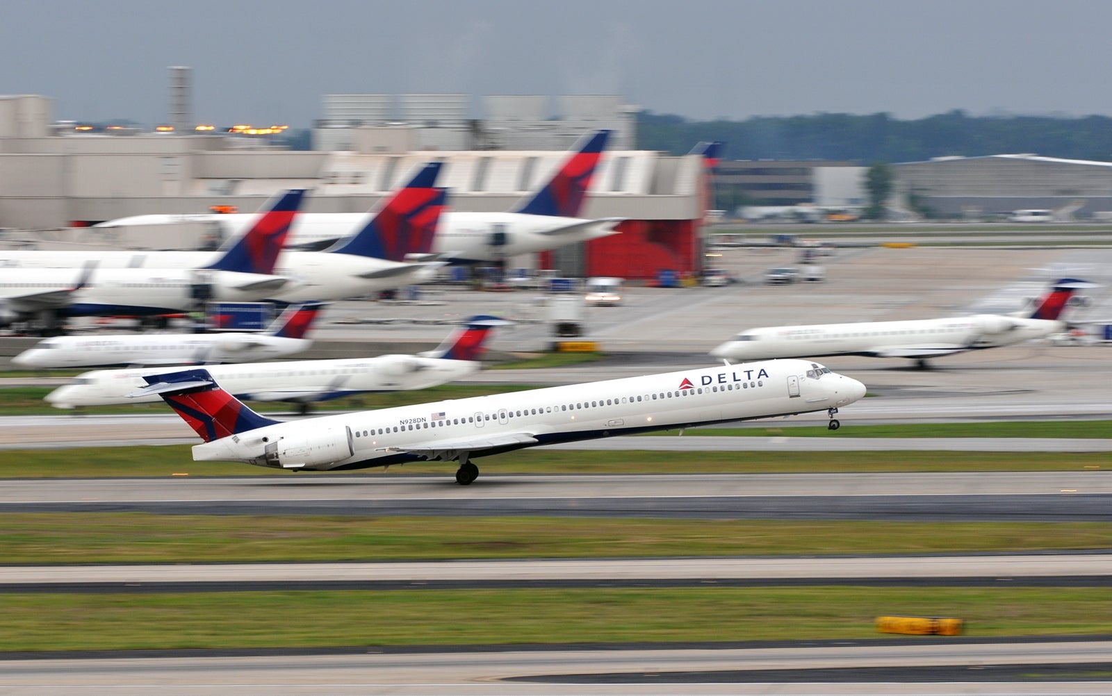 A Delta Air Lines MD-90 takes off from Atlanta in June 2014