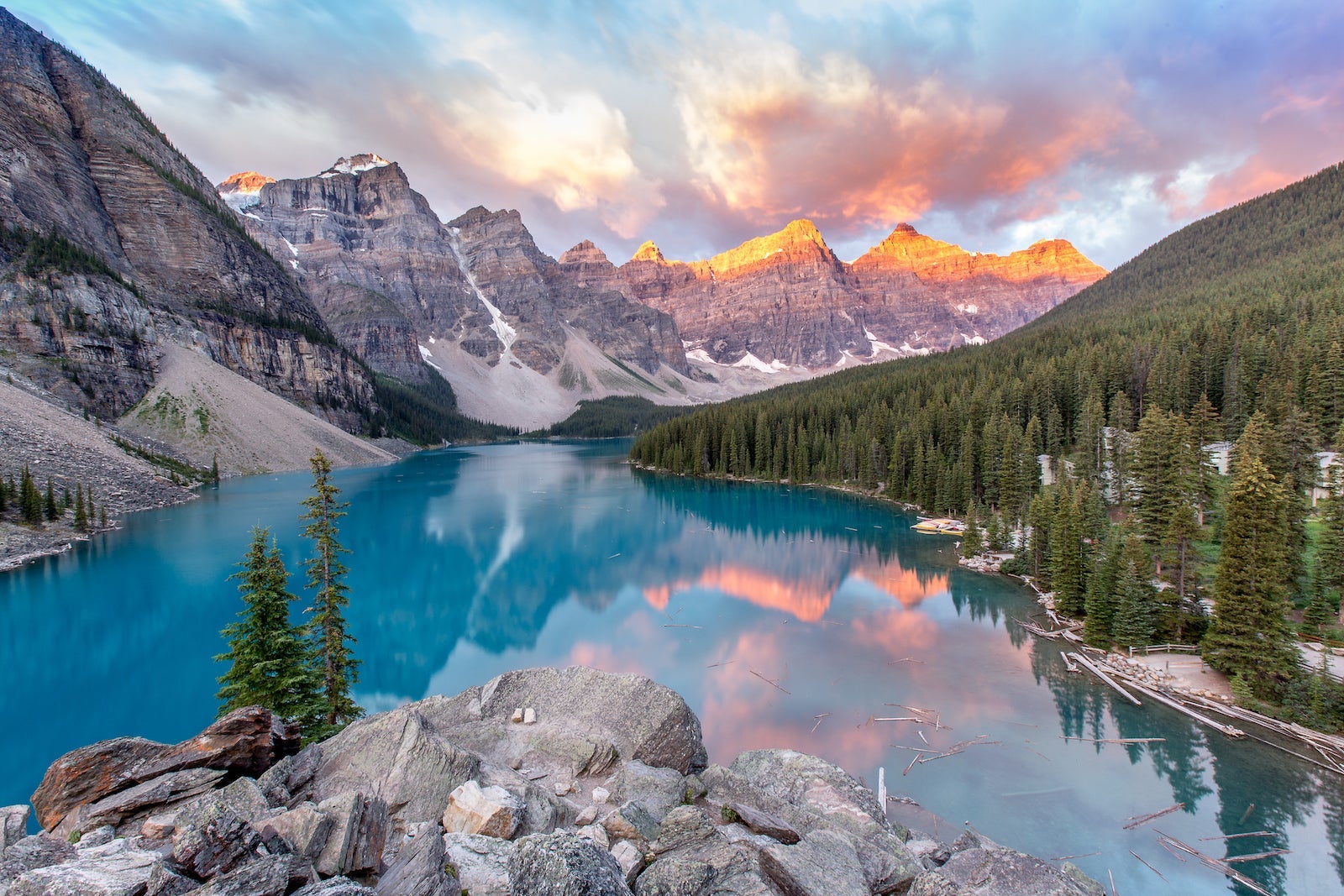 A lake and mountains at sunrise.