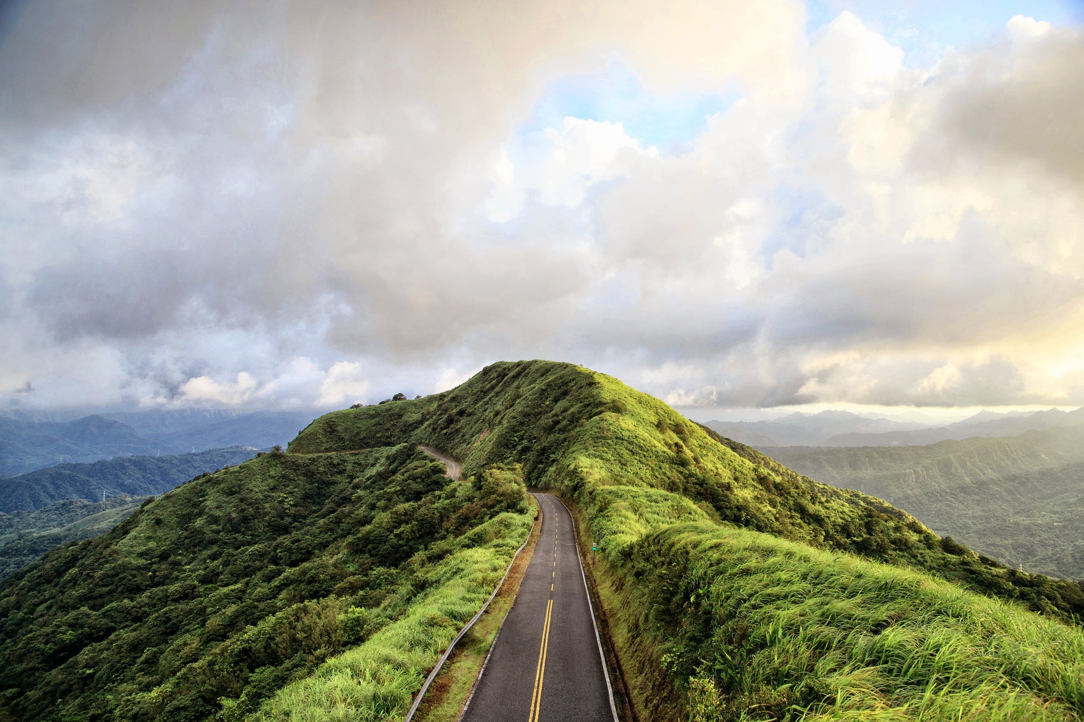 High Angle View Of Mountain Road Against Cloudy Sky