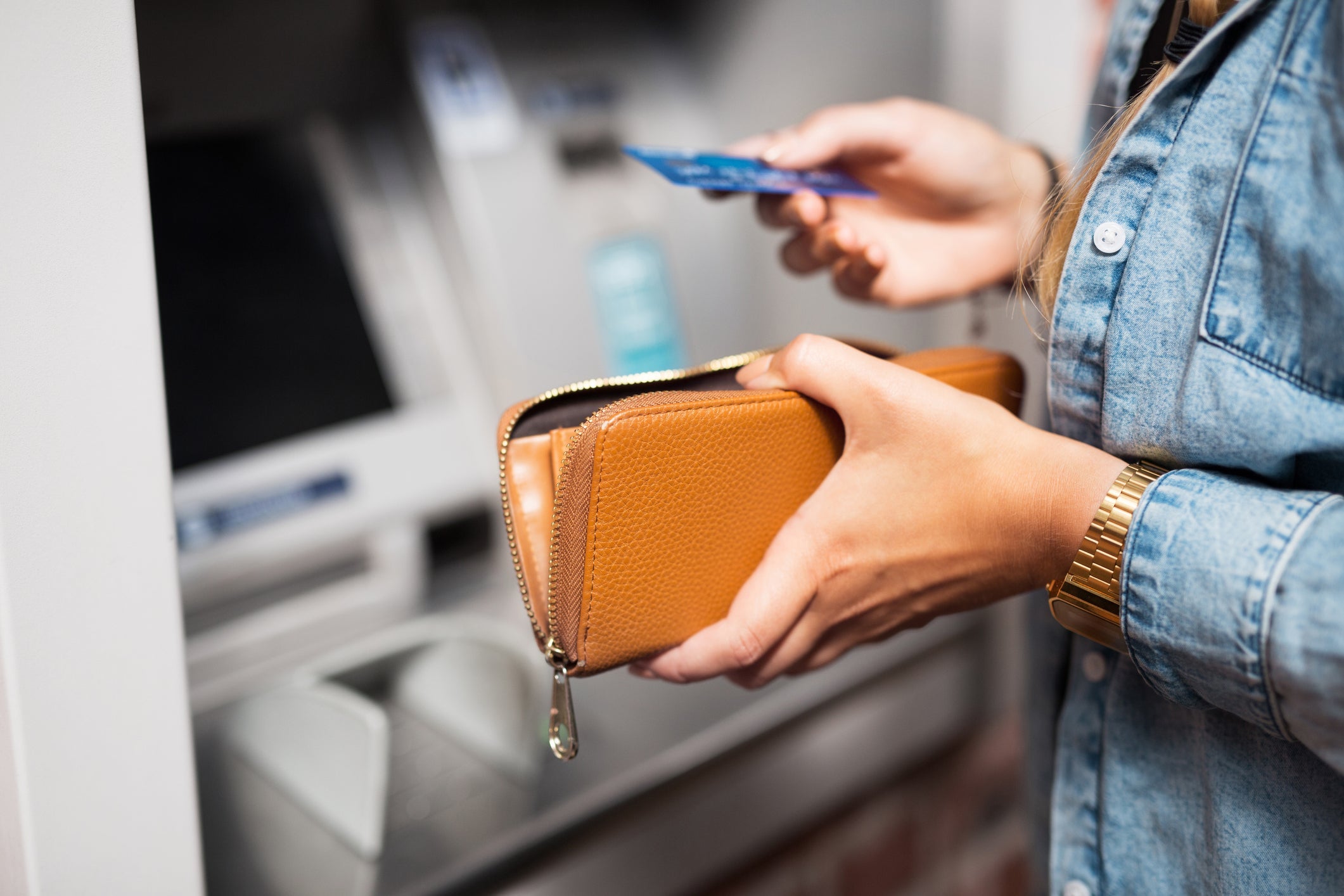 Woman withdrawing money from ATM