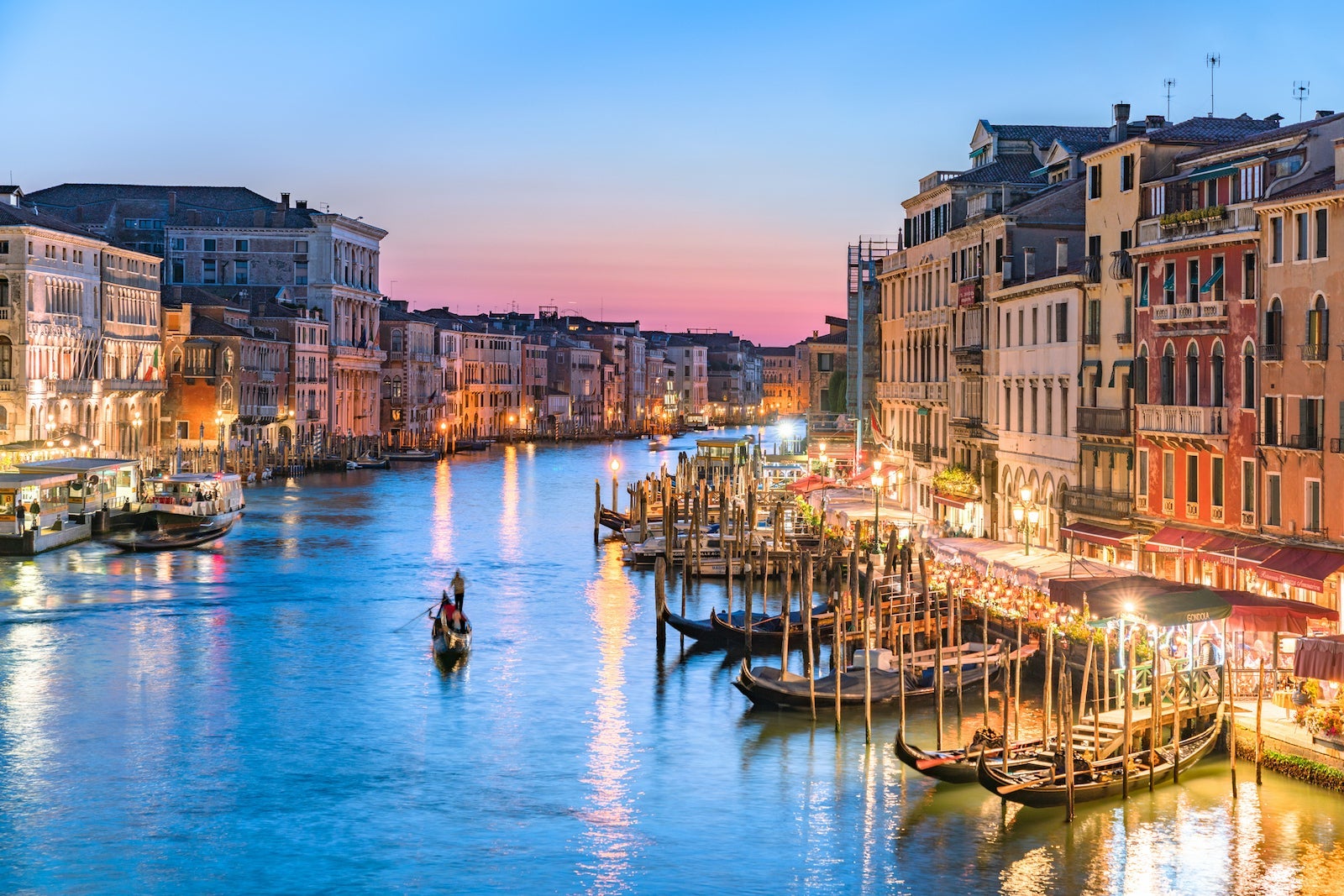 Gondolier Heads into the Sunset Along Venice's Grand Canal (Sunset)