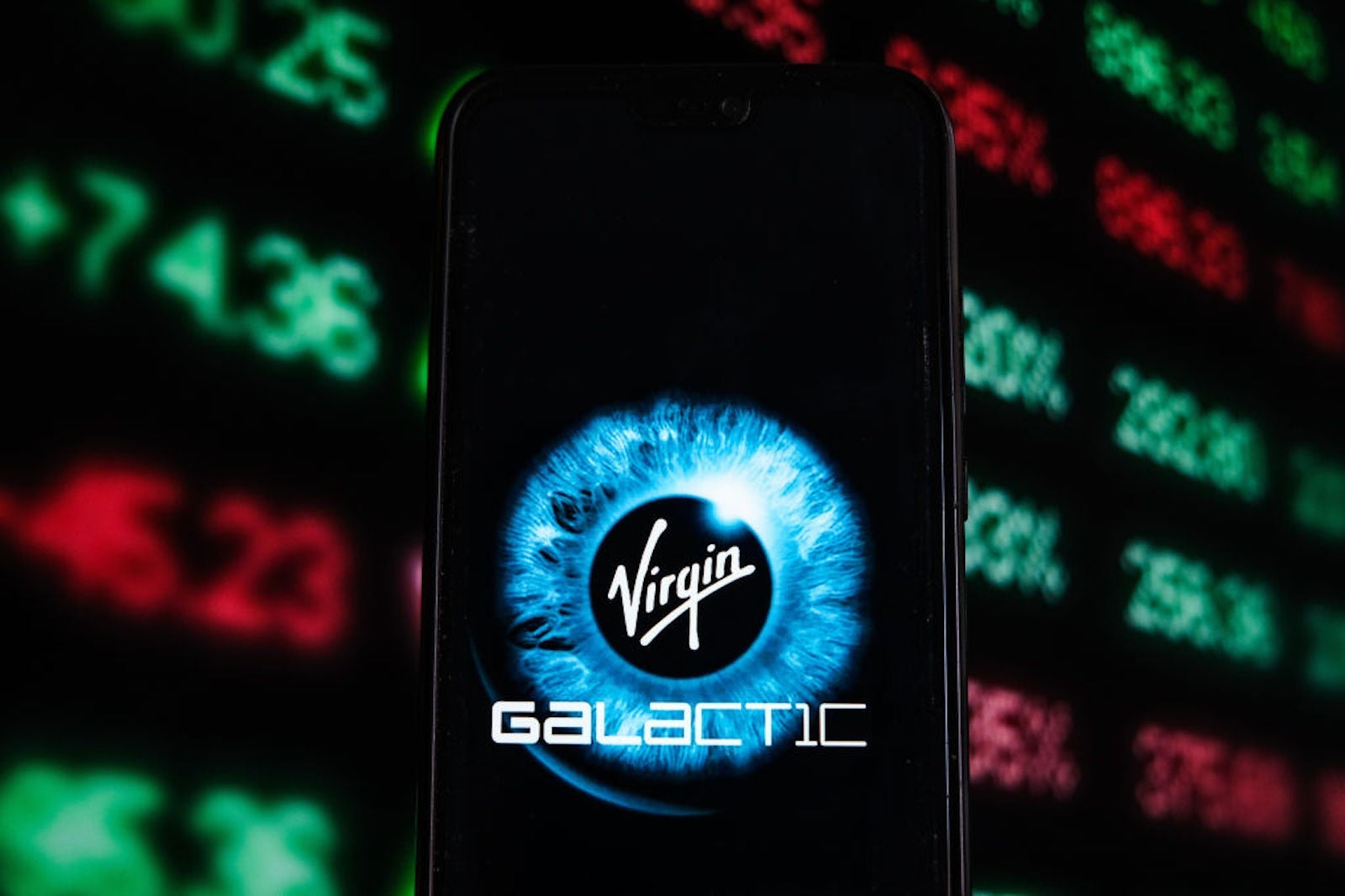 In this photo illustration a Virgin Galactic logo is seen