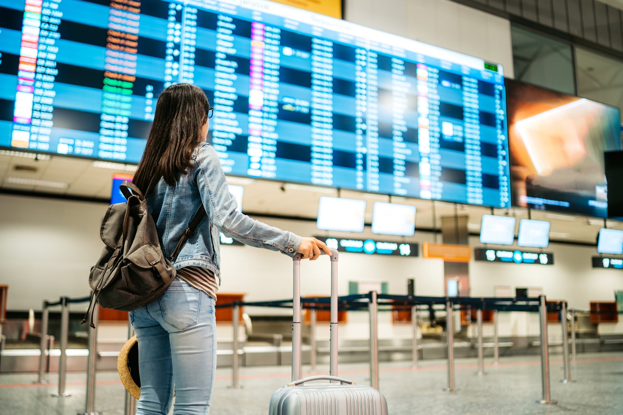 Tourist checking the arrival departure board