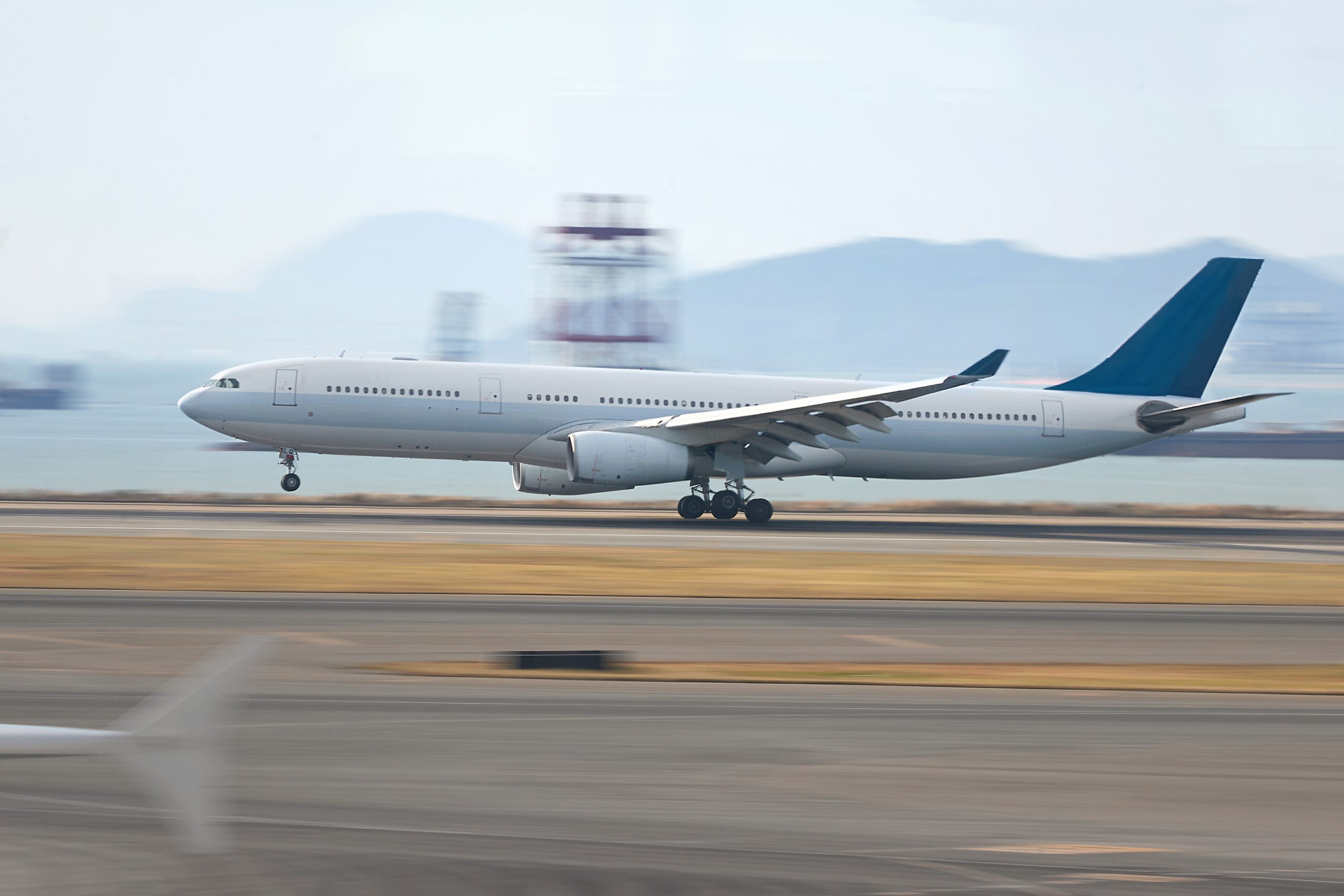Passenger Aircraft landing on airport runway