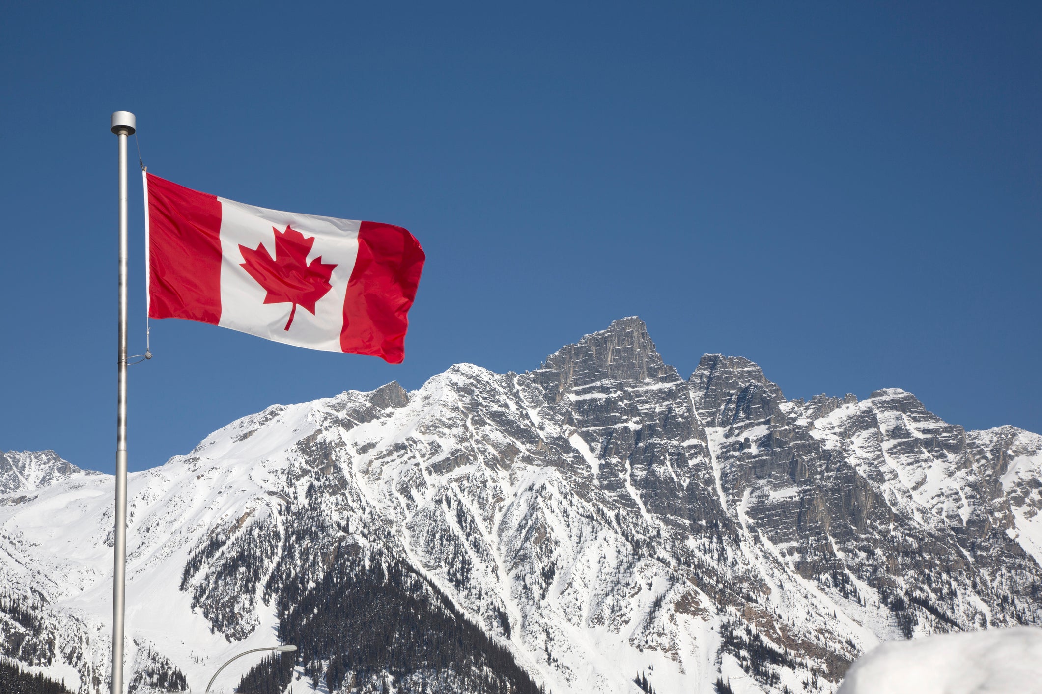 Canada flag in mountains