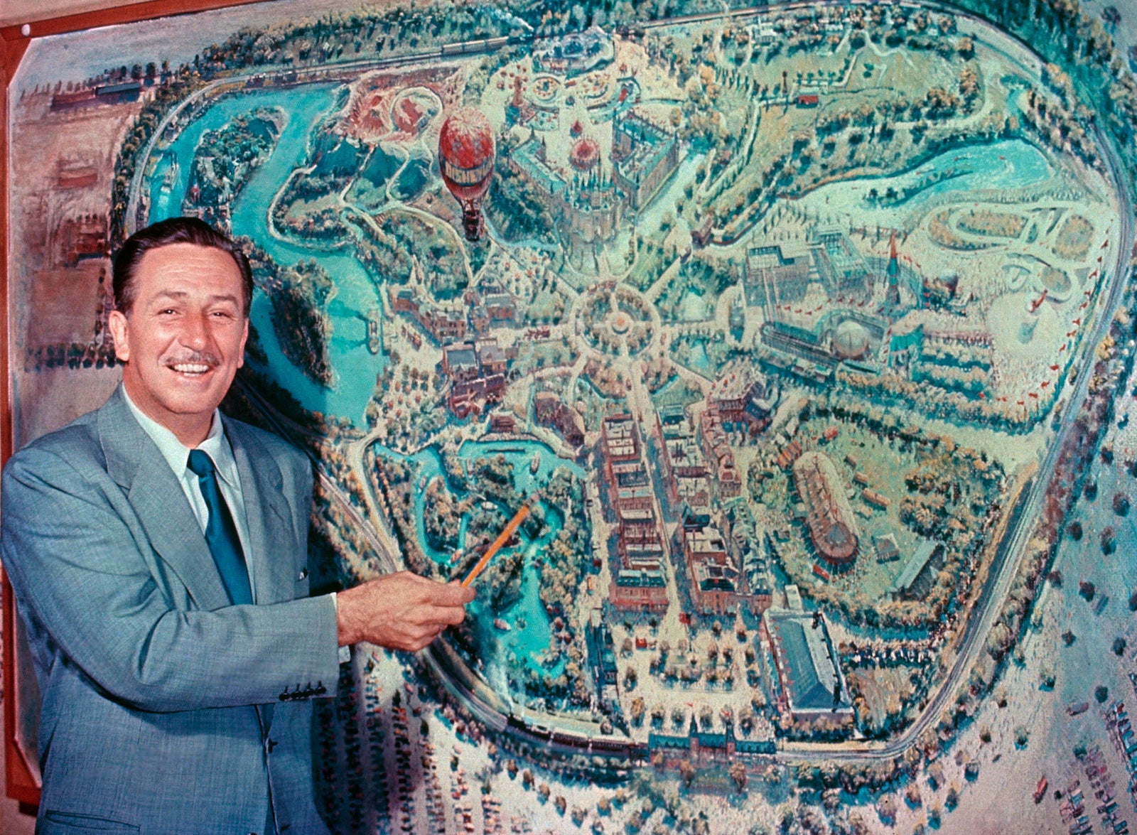 In front of an early rendering by Disney legend Peter Ellenshaw, Walt Disney unveils his plans for Disneyland to a national television audience during the premiere of “Disneyland” the television show, October 27, 1954.