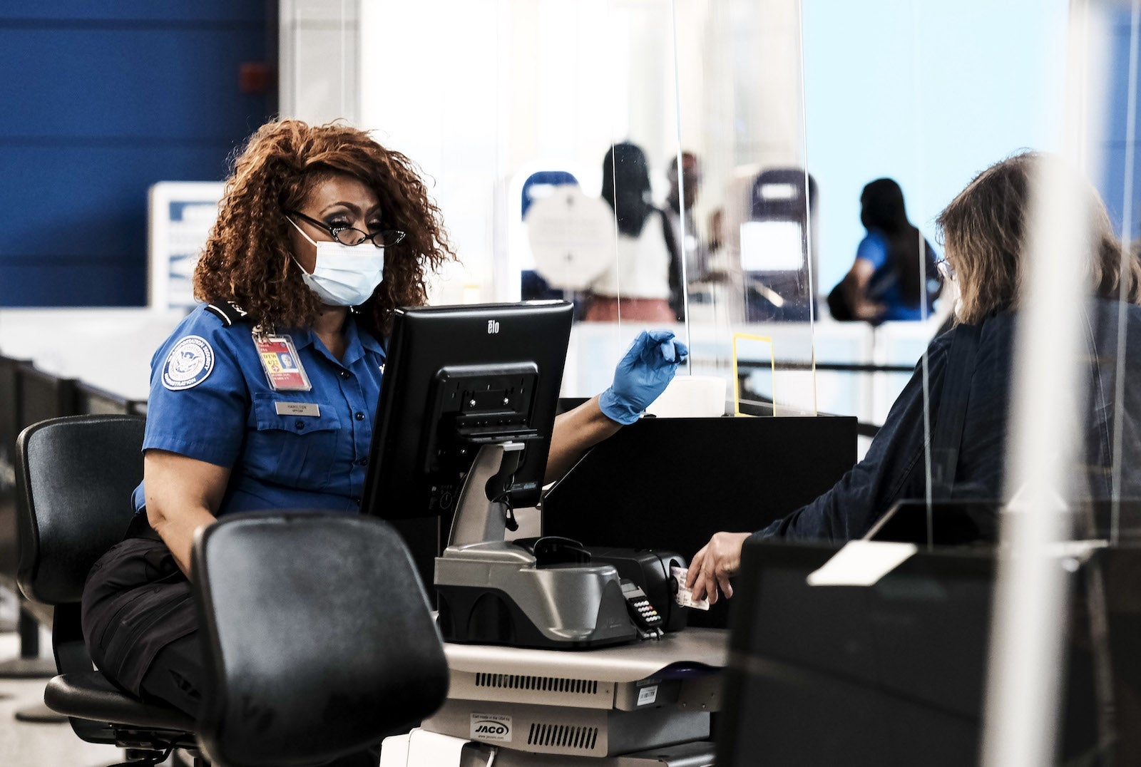 Travelers At Detroit Metro Airport As TSA Experiences Staff Shortages