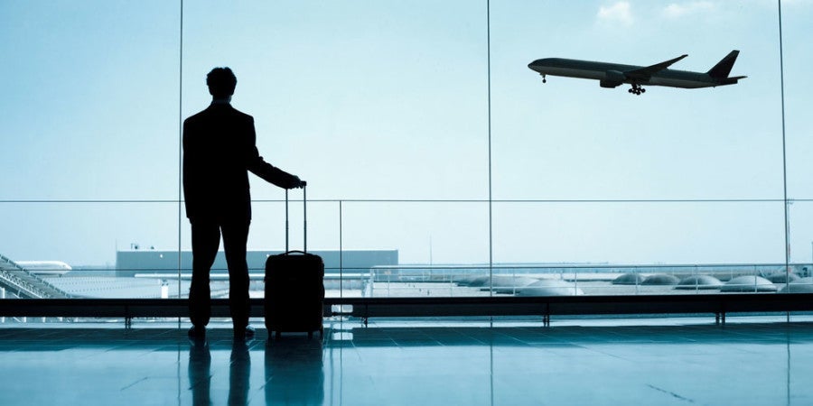 man with suitcase featured