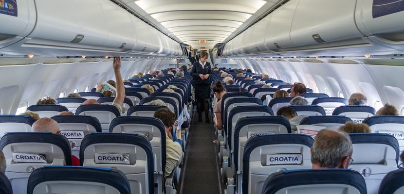 Airplane Cabin Passengers Featured