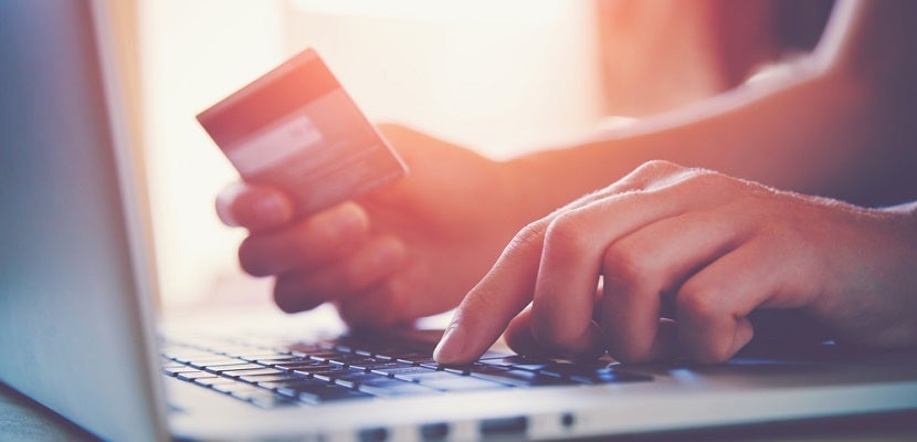 Shopping online credit card computer laptop featured shutterstock 289585190