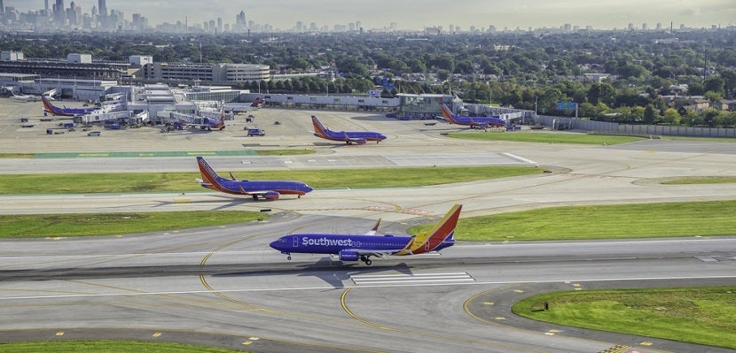 Southwest planes on runway Chicago featured shutterstock 347960354