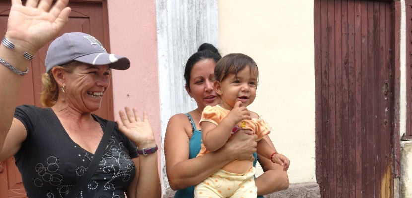 Family waving hello to us