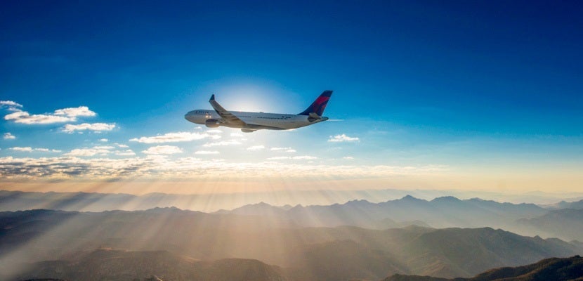 IMG Delta plane mountains sunset silhouette featured