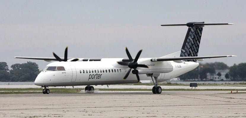 The first Porter Airlines plane taxis to the ramp at the City Centre Airport in Toronto, Tuesday Aug
