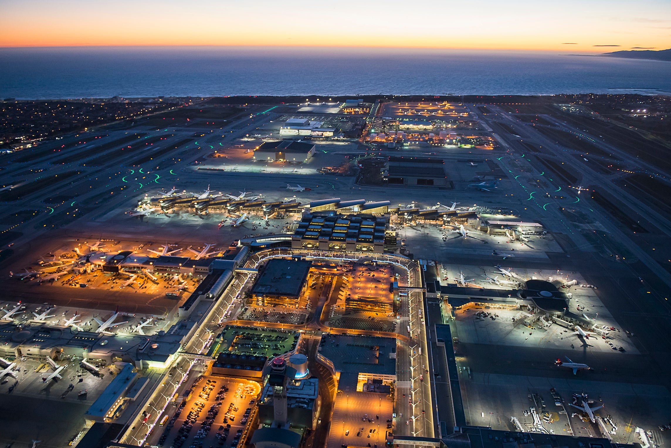 Aerial view of airplanes parked in airport gates