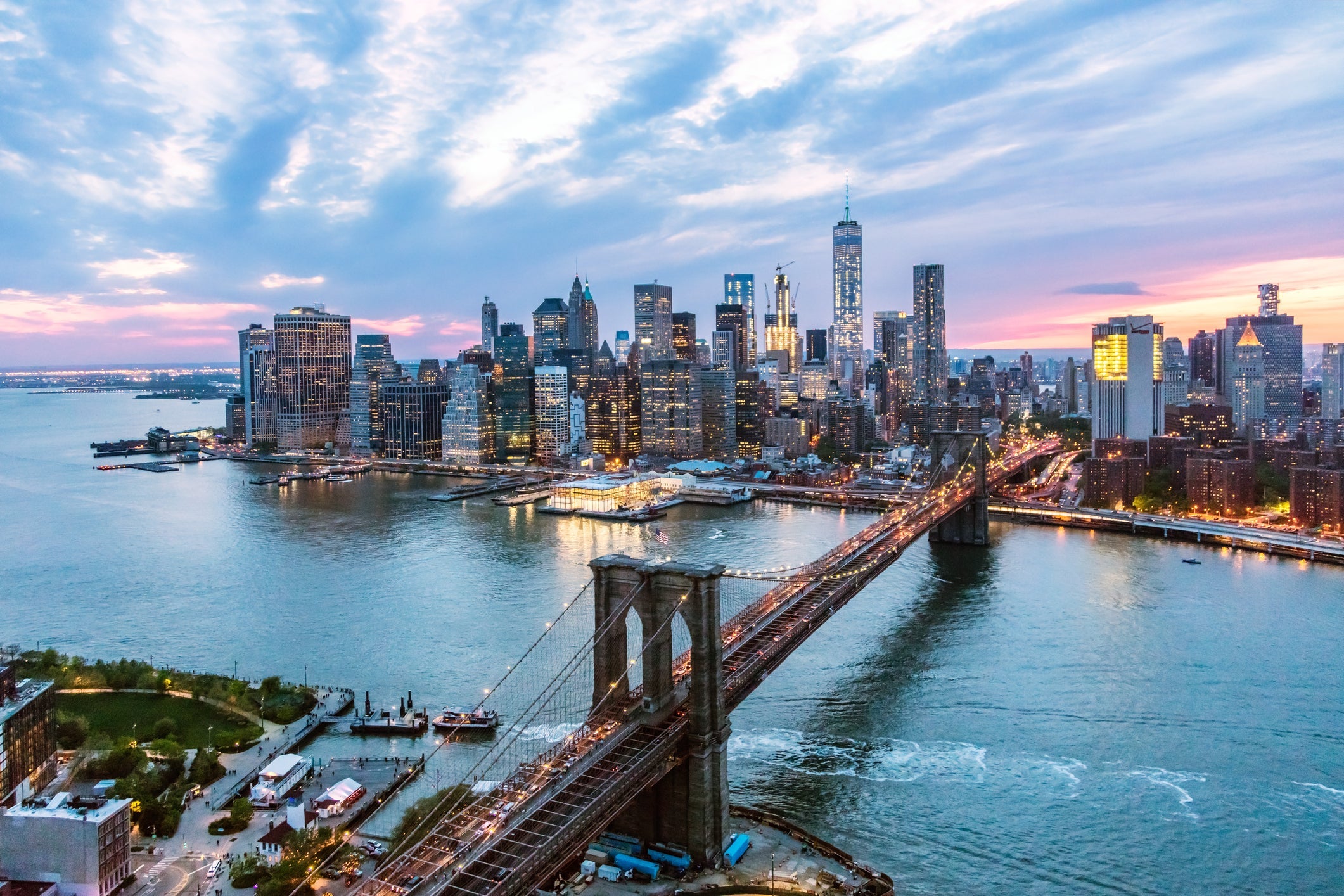 Aerial of New York city and Brooklyn bridge at dusk
