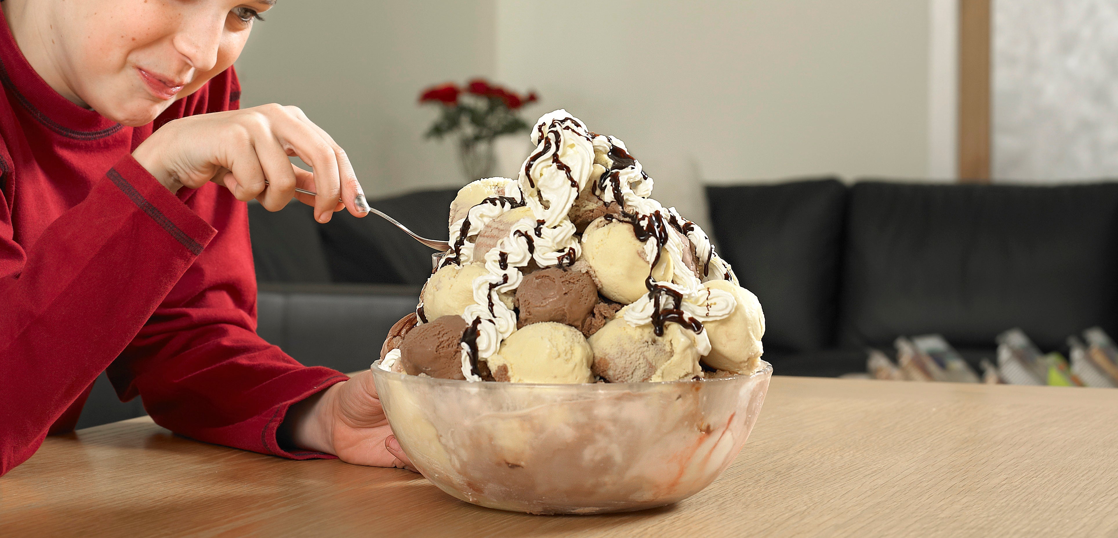Boy eating large bowl of ice cream