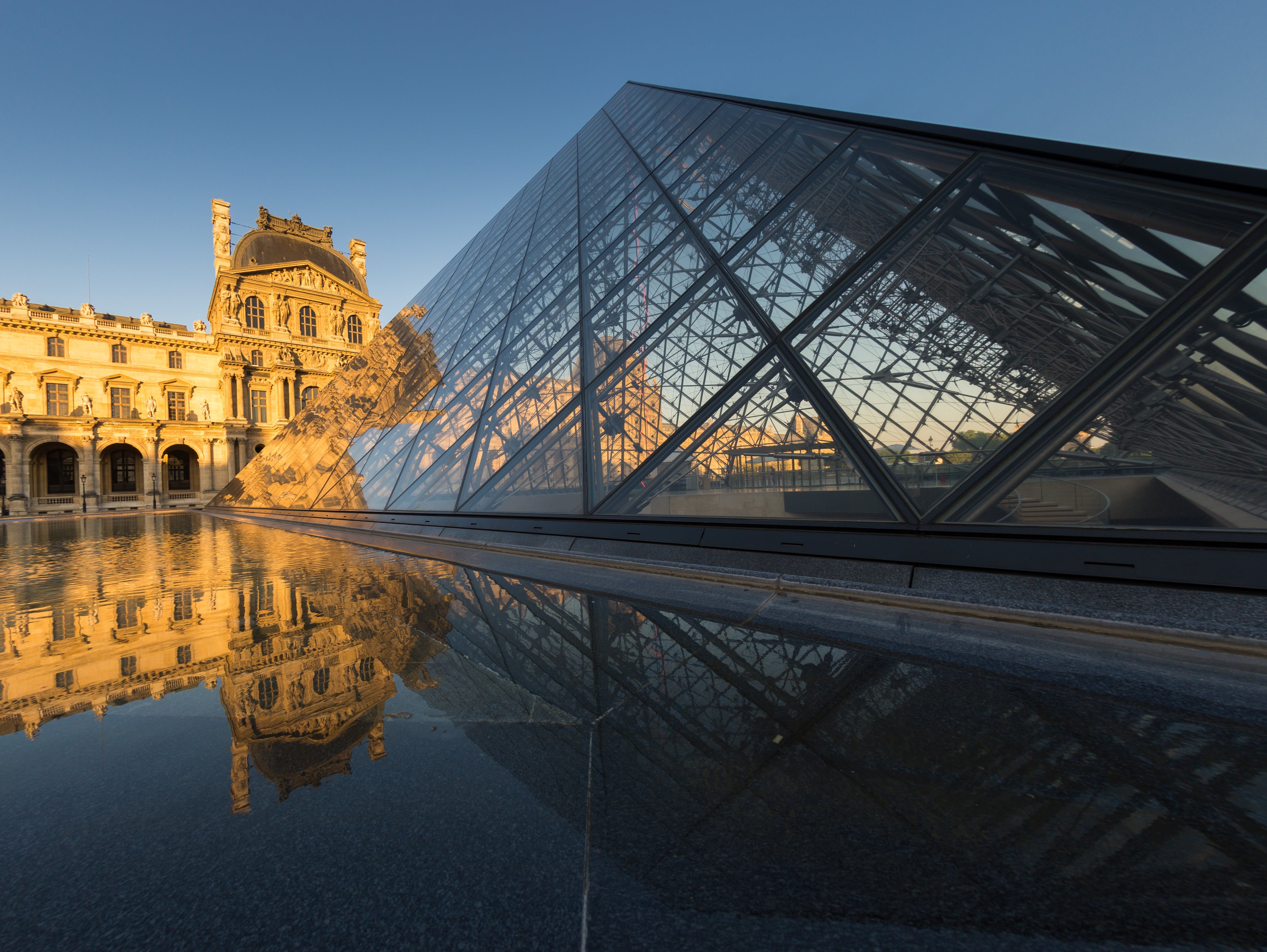 The Louvre museum with reflection