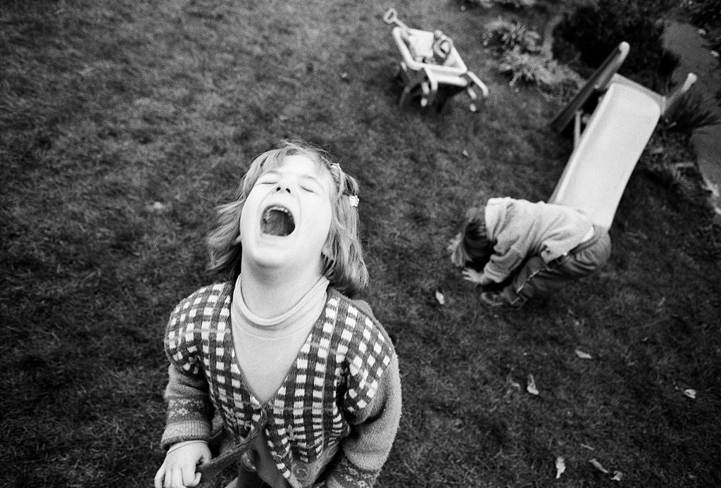 England - London - Young girl throws tantrum during garden game
