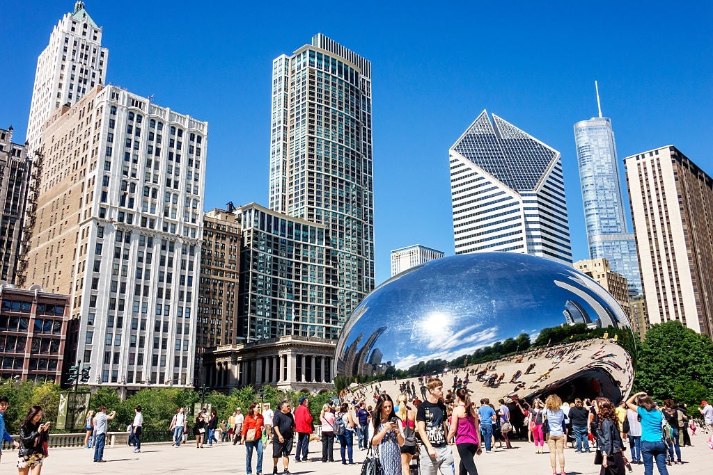 Millennium Park, Cloud Gate The Bean, public art with reflection of the distorted city skyline.