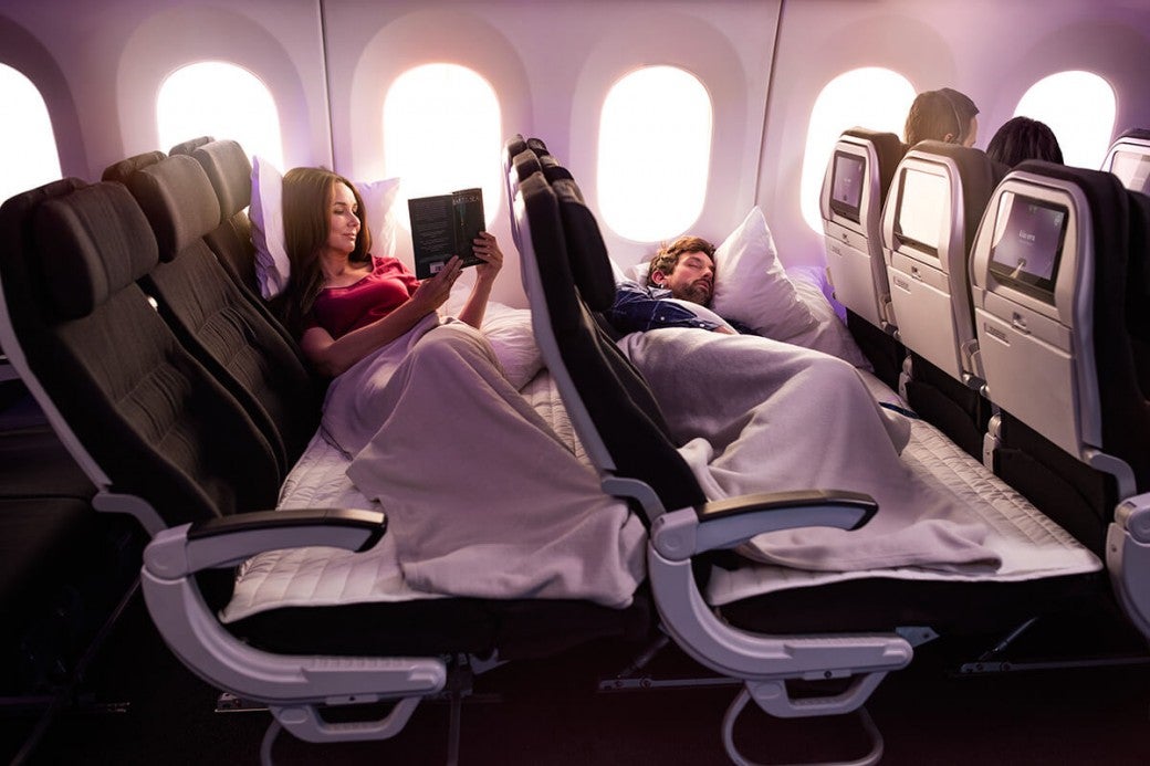 airnz-economy-skycouch-male-sleeping-1200x800__ScaleWidthWyIxMDQwIl0