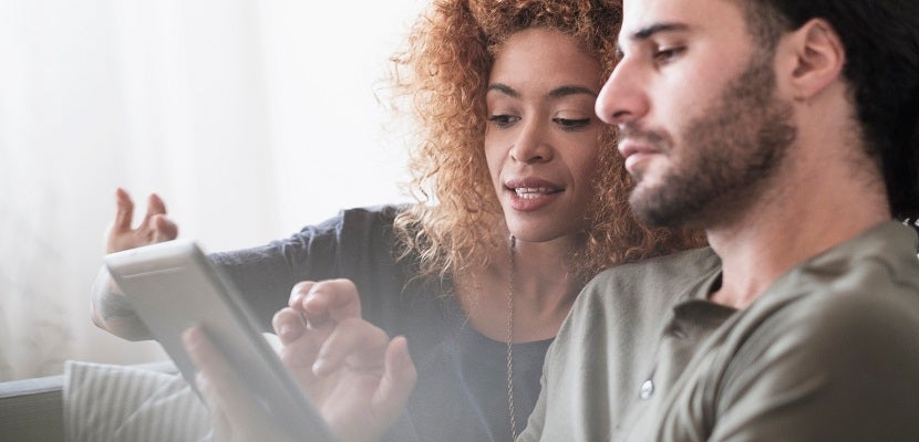 Young couple using tablet