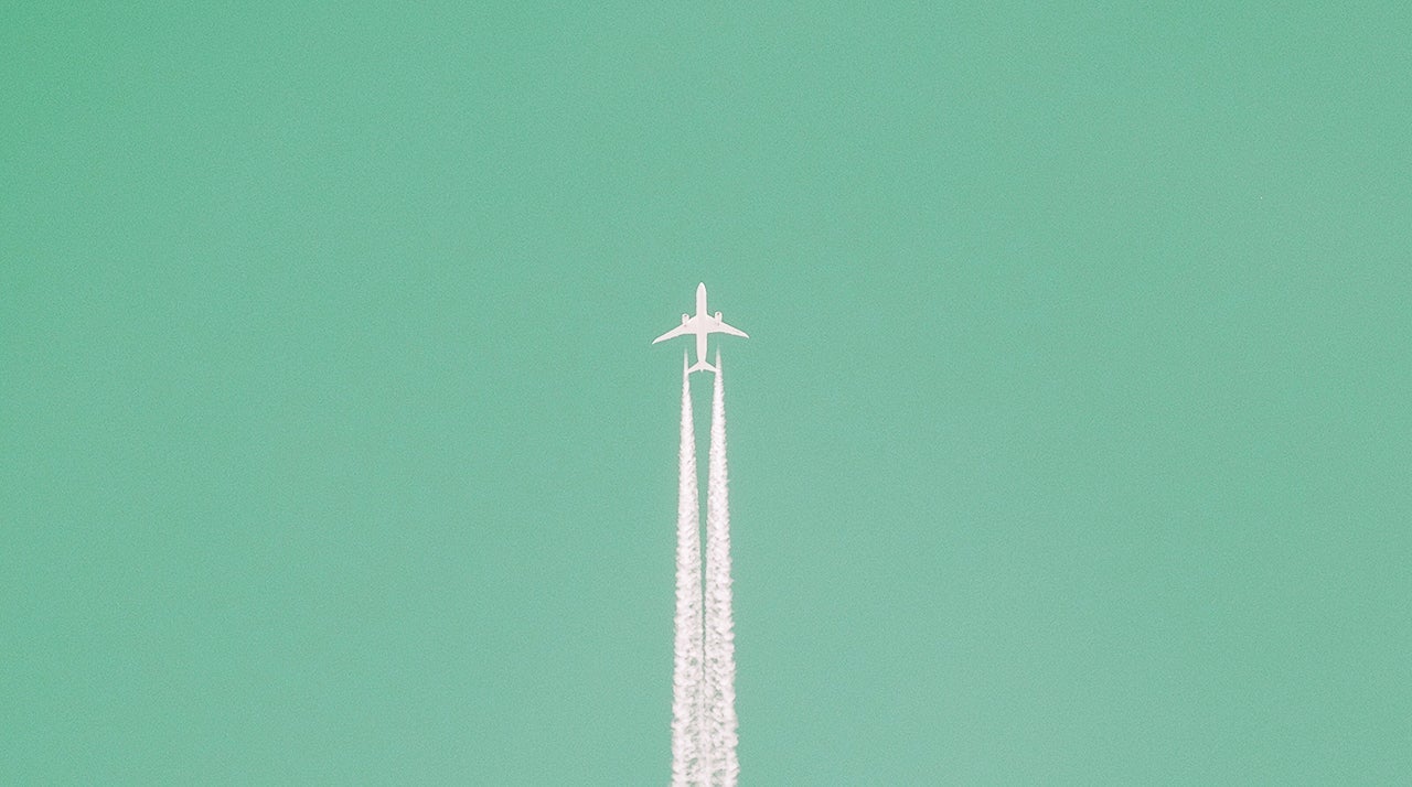 Low Angle View Of Airplane In Sky