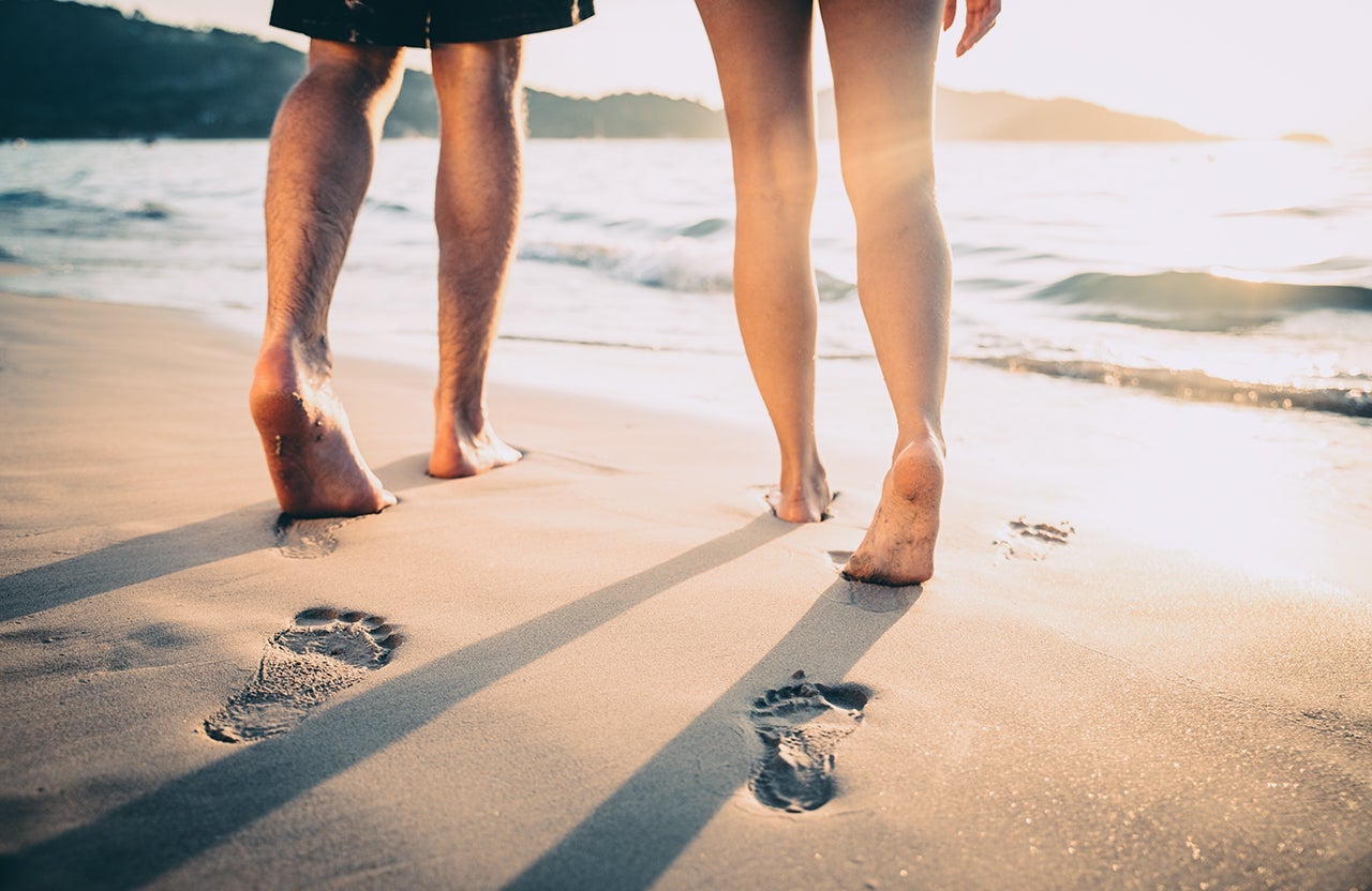 Lovers walking on the beach