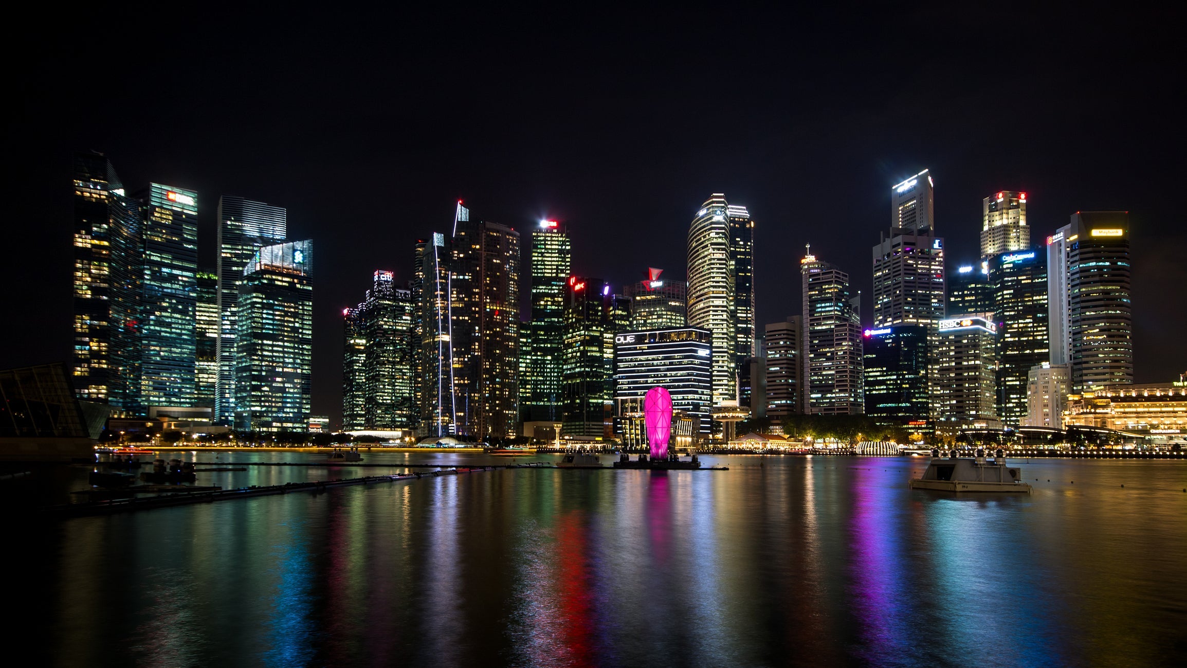 Singapore`s business district buildings, night sky and view for marina bay