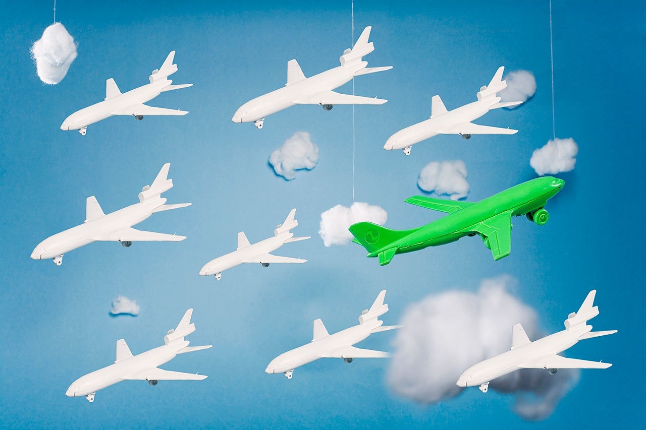 Green plane in group of whites