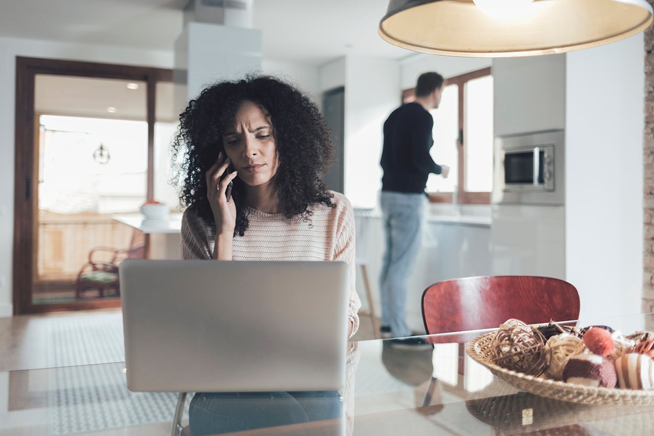 Woman using laptop computer at home