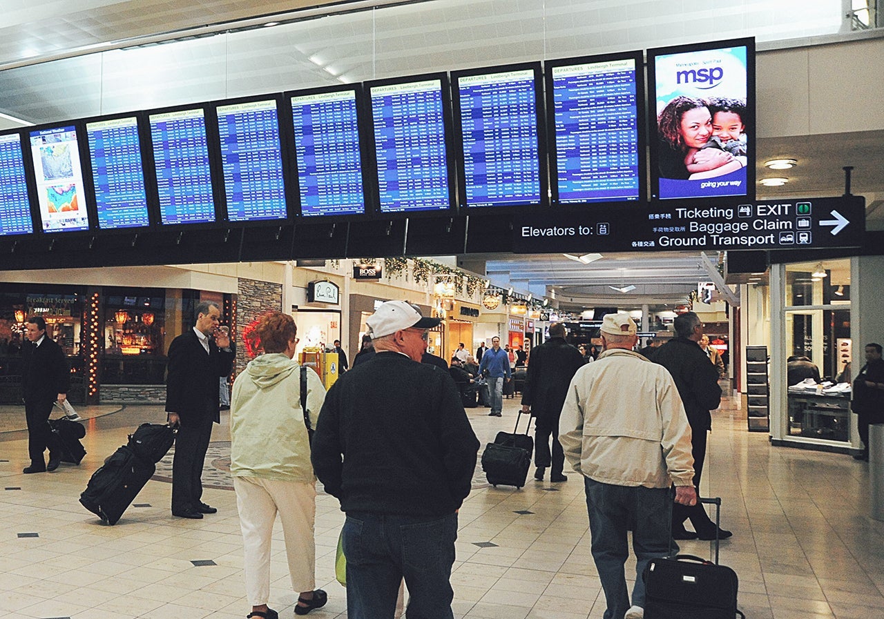 Travellers walk through the main concour