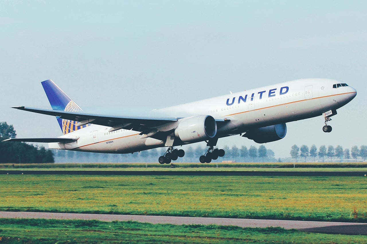 united widebody jet United Airlines Boeing 777 departure from Amsterdam Schiphol Airport