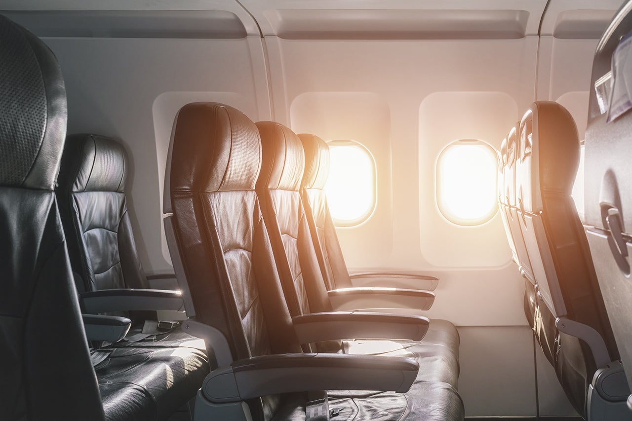 Empty seats and window inside an aircraft