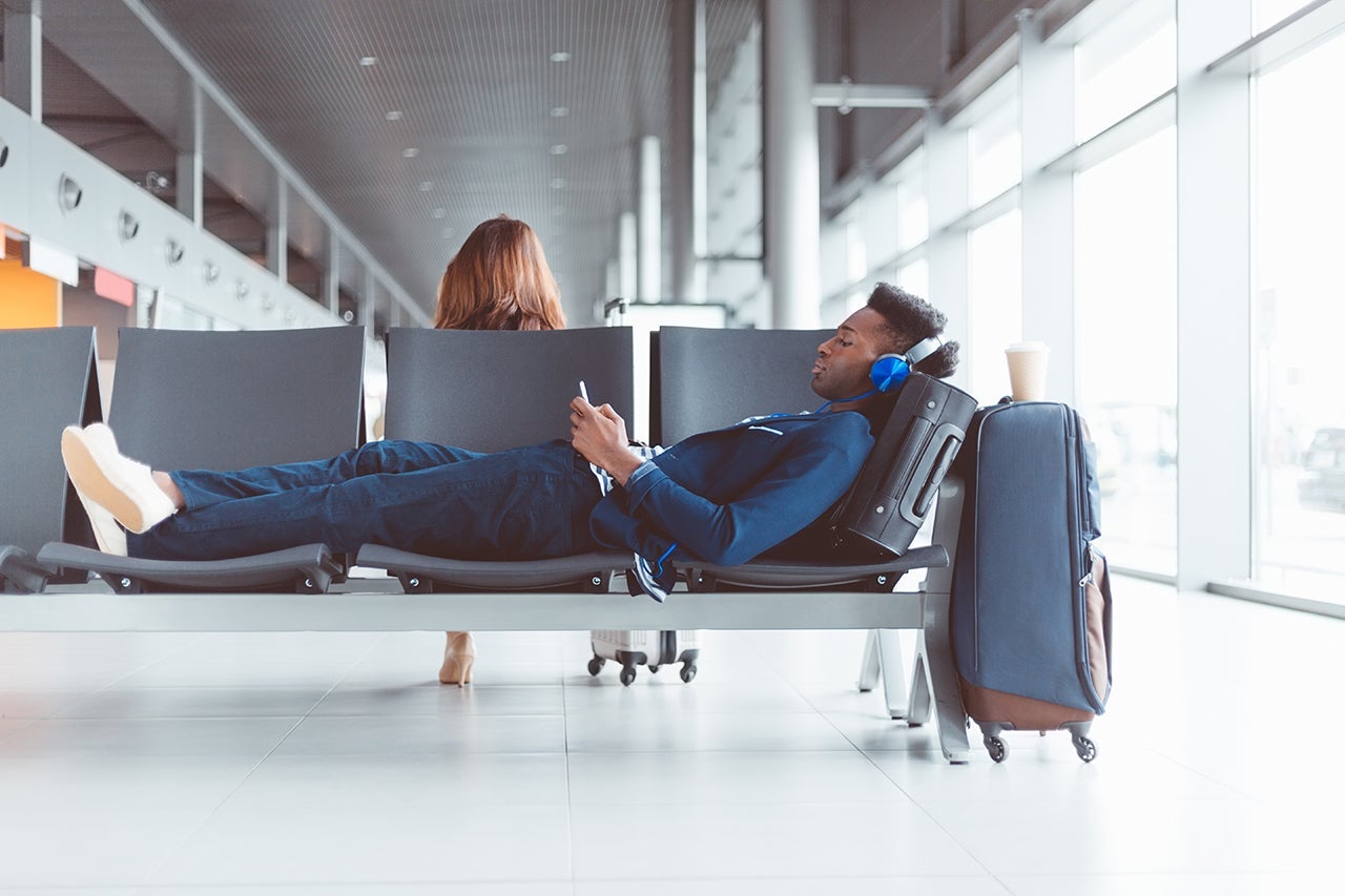 Young african man waiting for flight