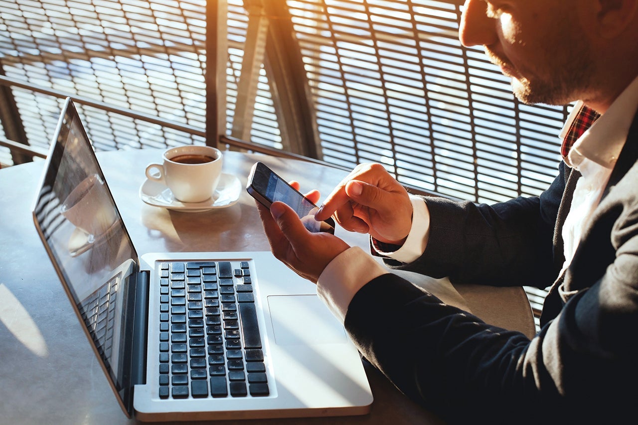 businessman checking email on smartphone