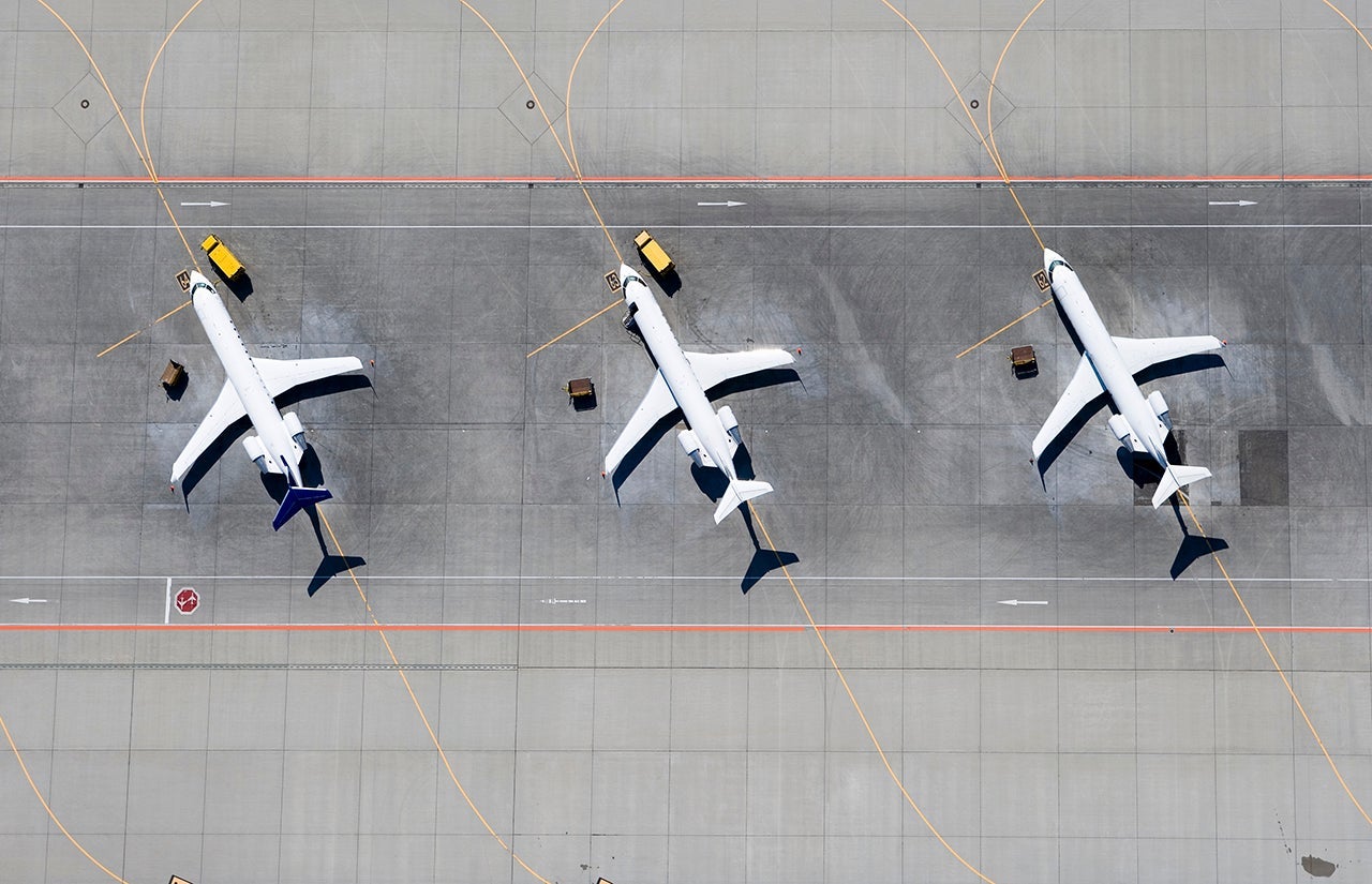 Aerial view of three airplanes in a row