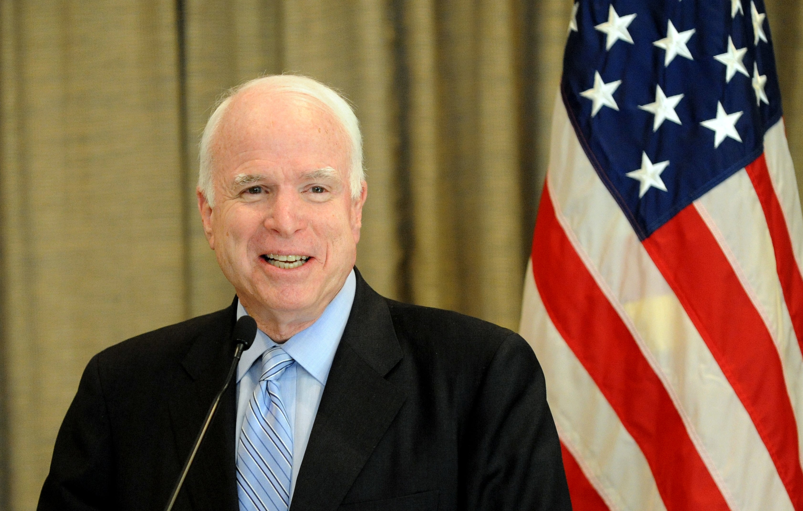 US senator John McCain smiles during a p