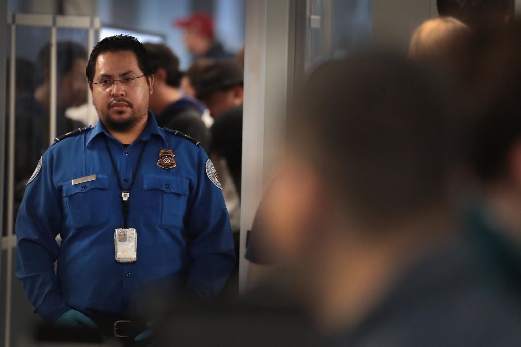 TSA Agents Work At Airport Security As Government Shutdown Continues