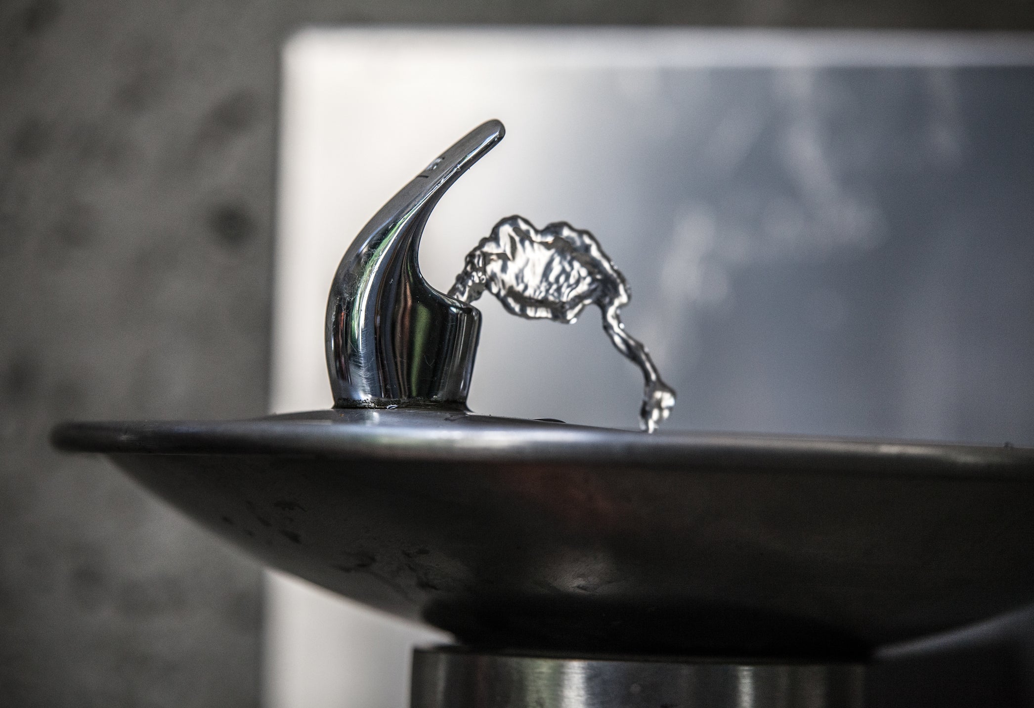 Detail of drinking fountain (spigot) with running water