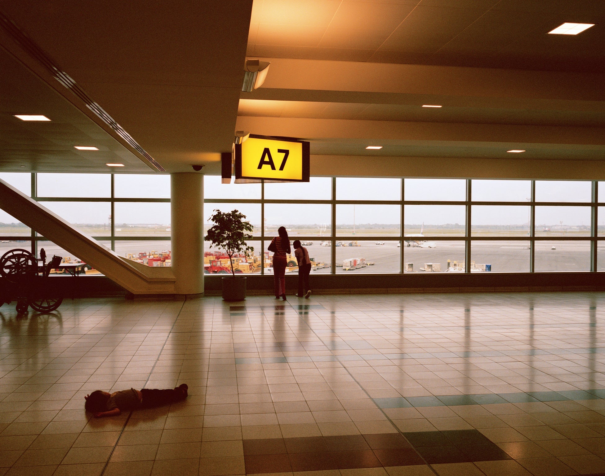 child on ground airport