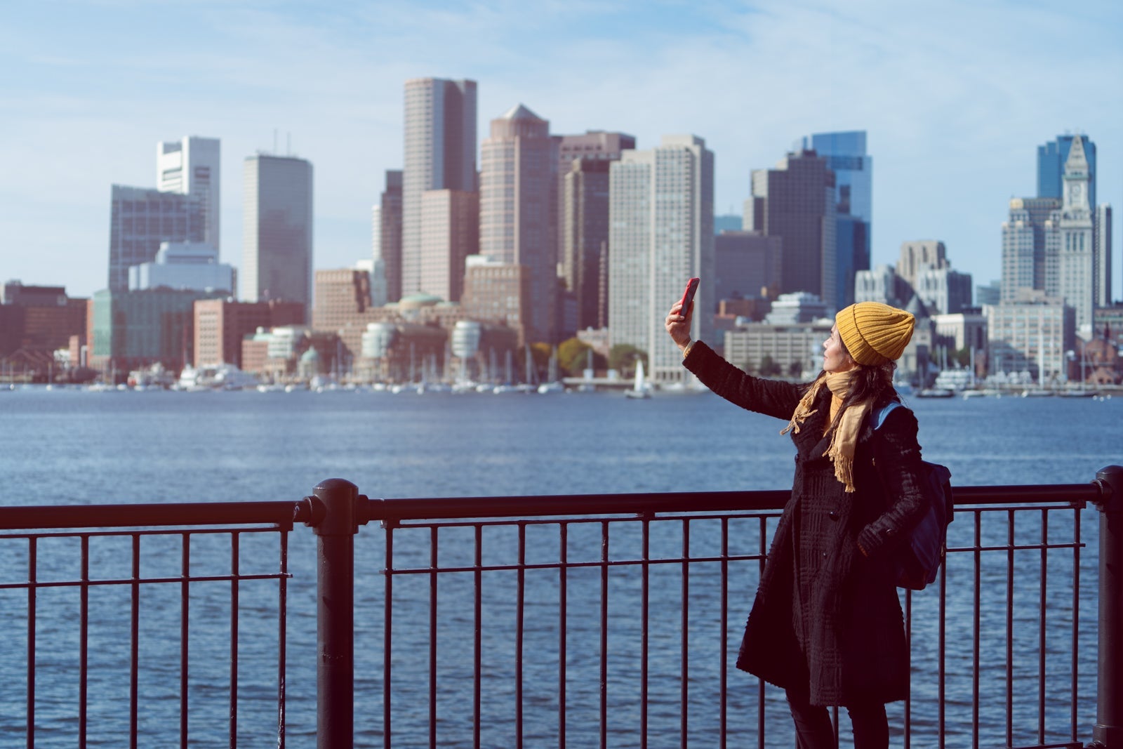 Woman tourist selfies with mobile phone