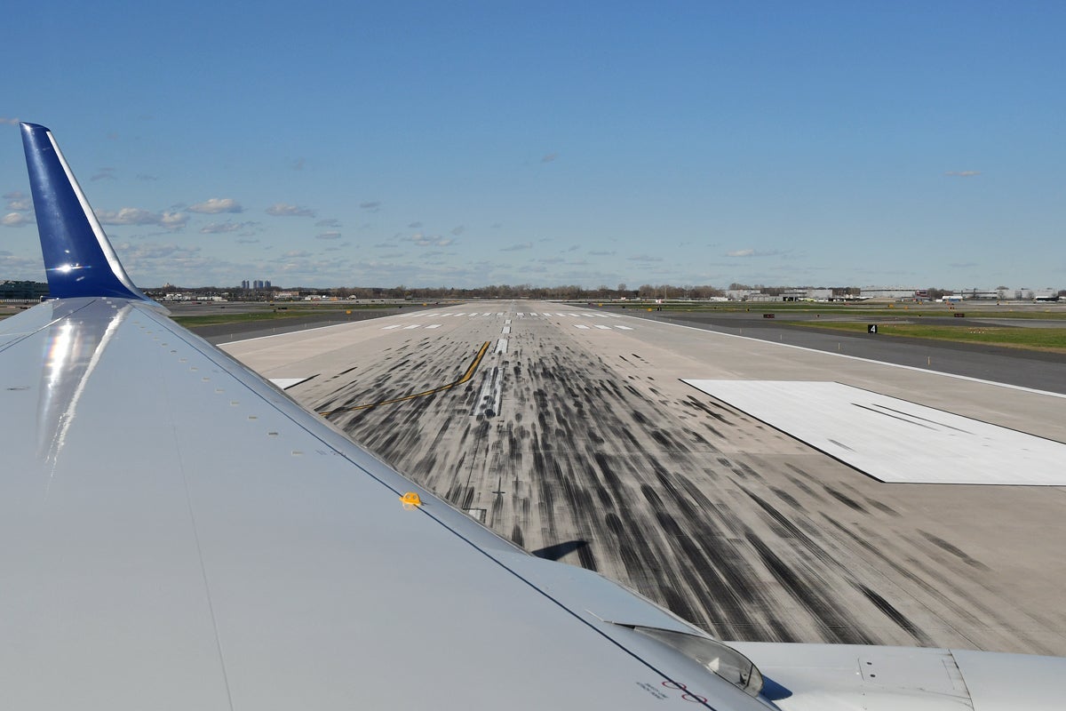 JFK airport runway with wing