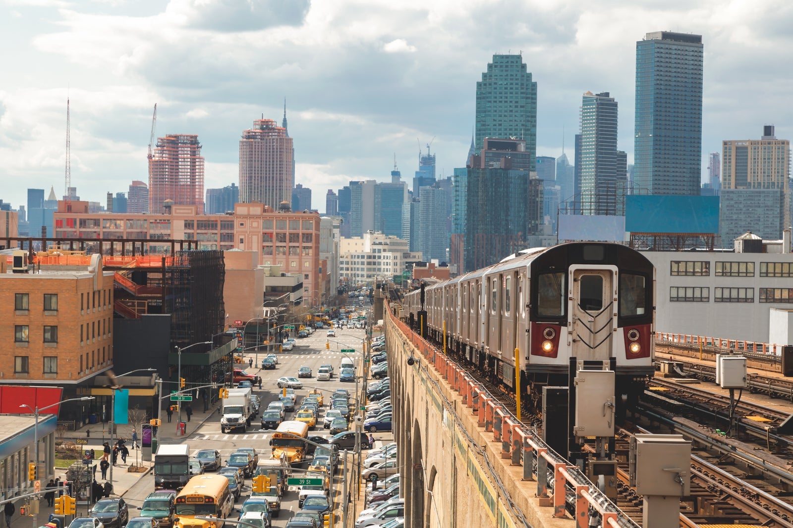 Subway Train Approaching Elevated Subway Station in Queens, New York
