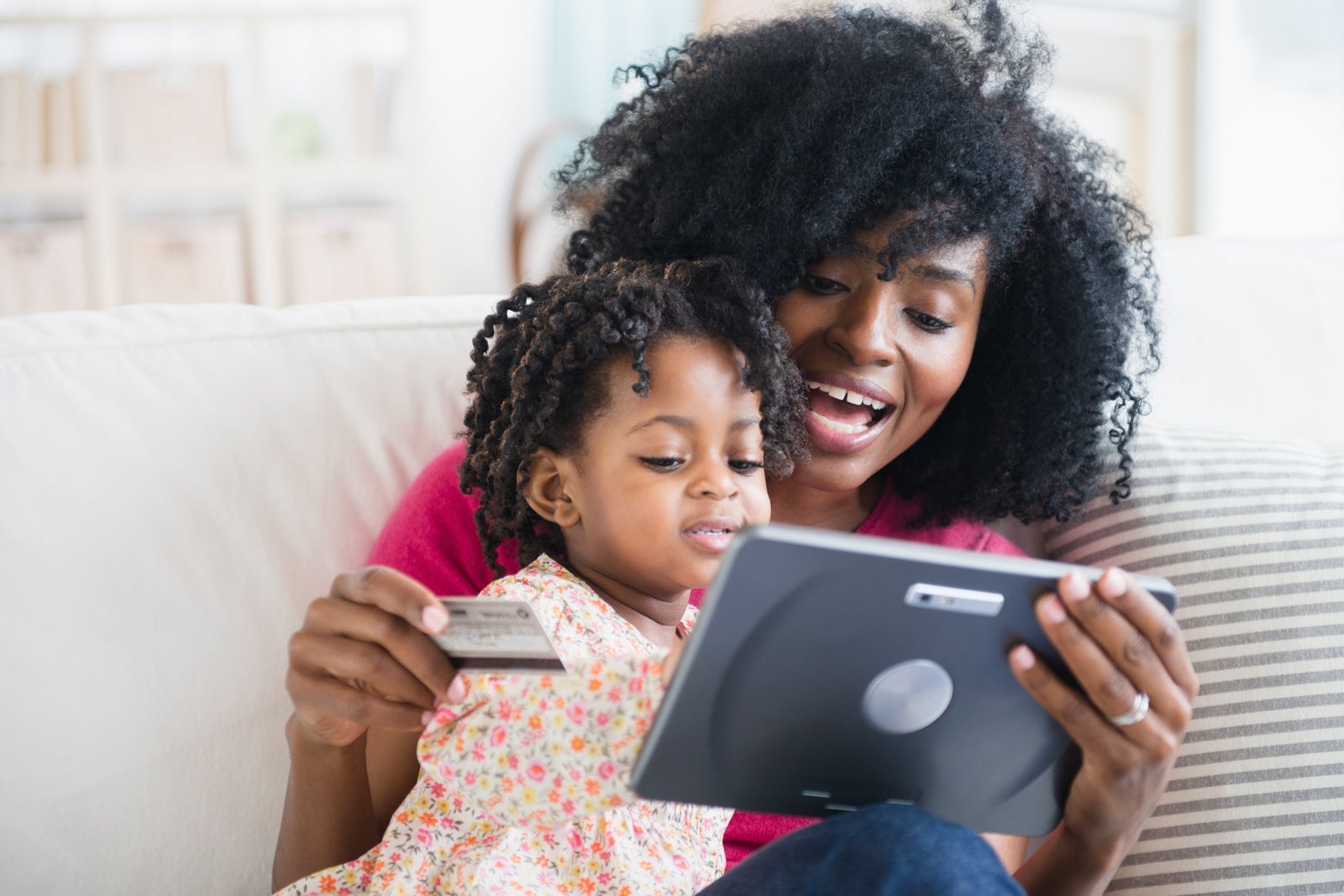 Mother and daughter shopping on tablet computer