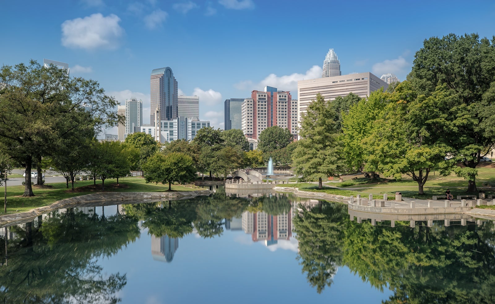 The Skyline of Charlotte is reflecting on the Water in Marshall Park
