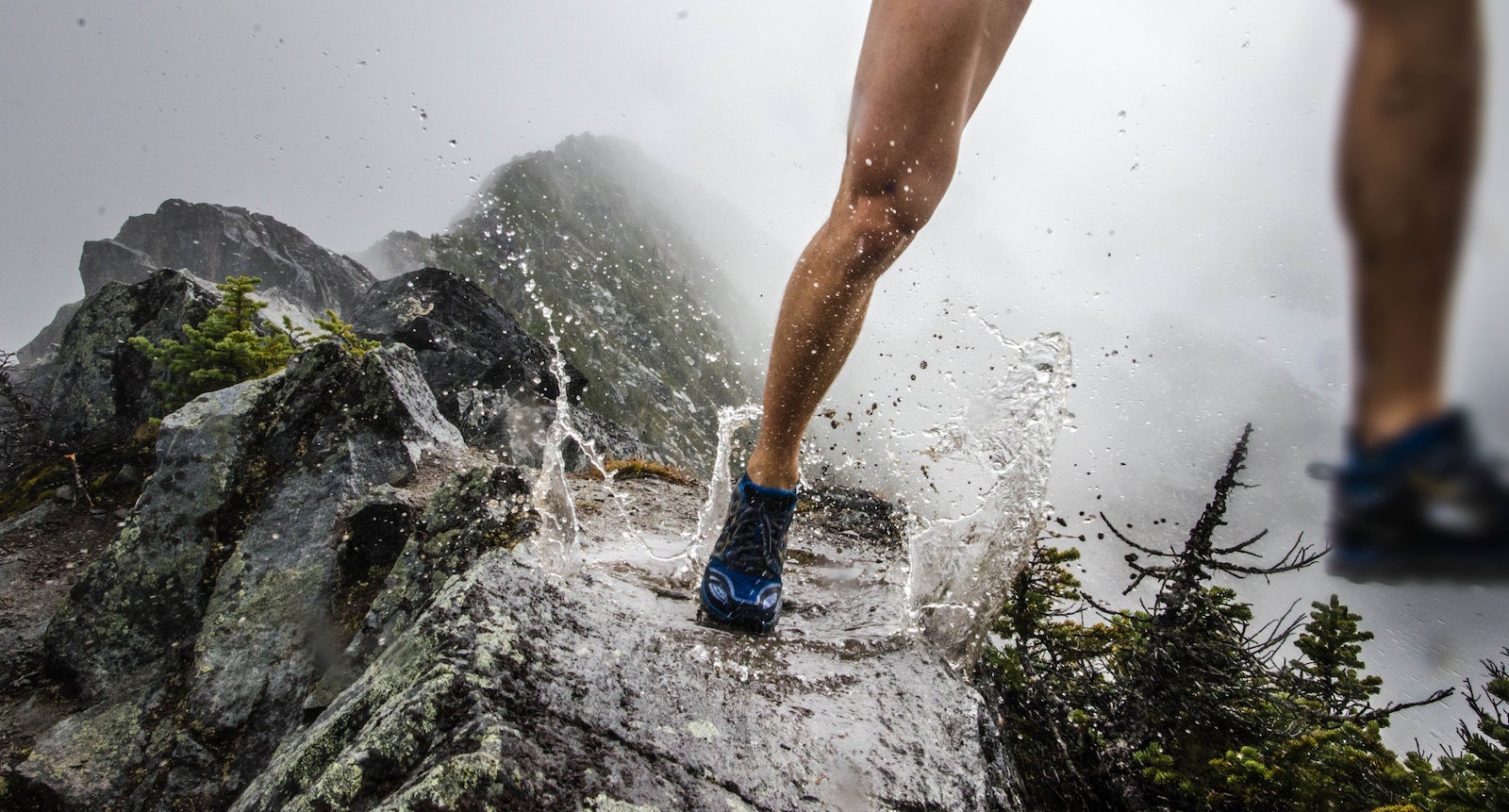 Running on mountain ridge in puddle